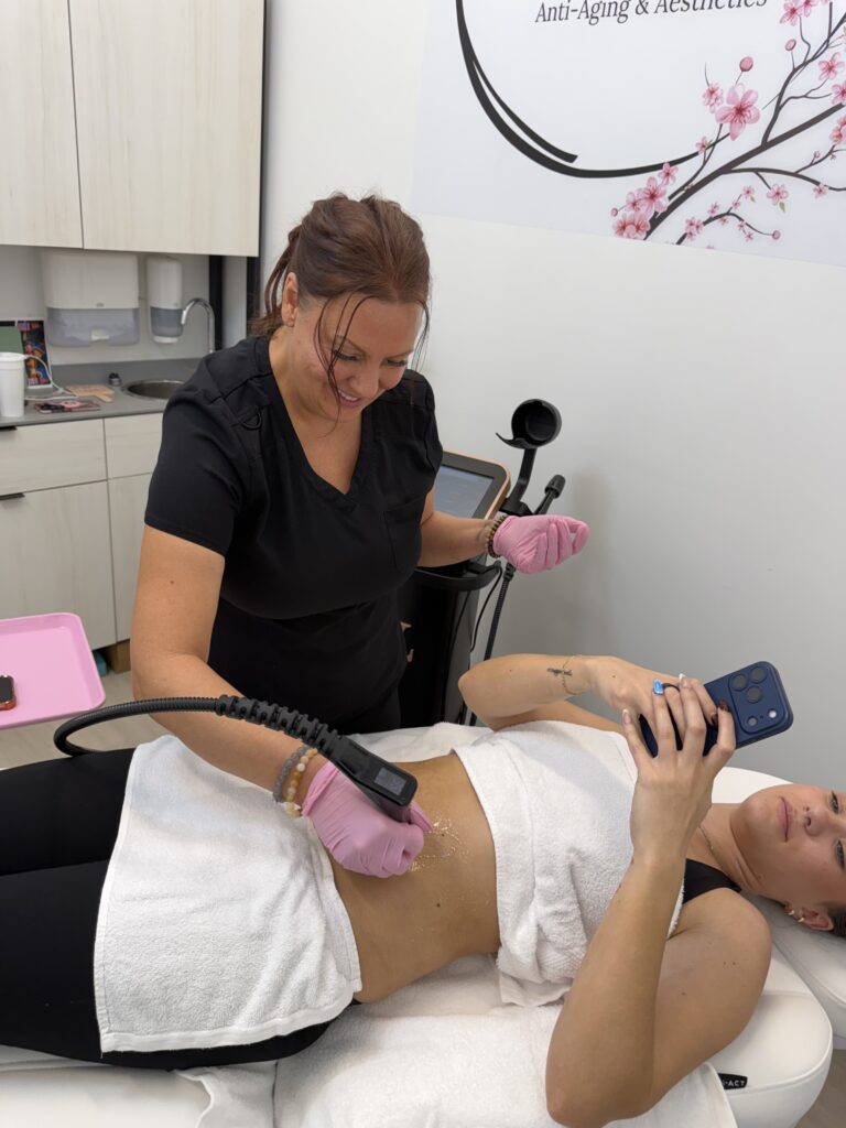 Laura McDonald, FNP-BC, performing triLift skin tightening and body sculpting in the Rewind Time studio in Lenexa, KS