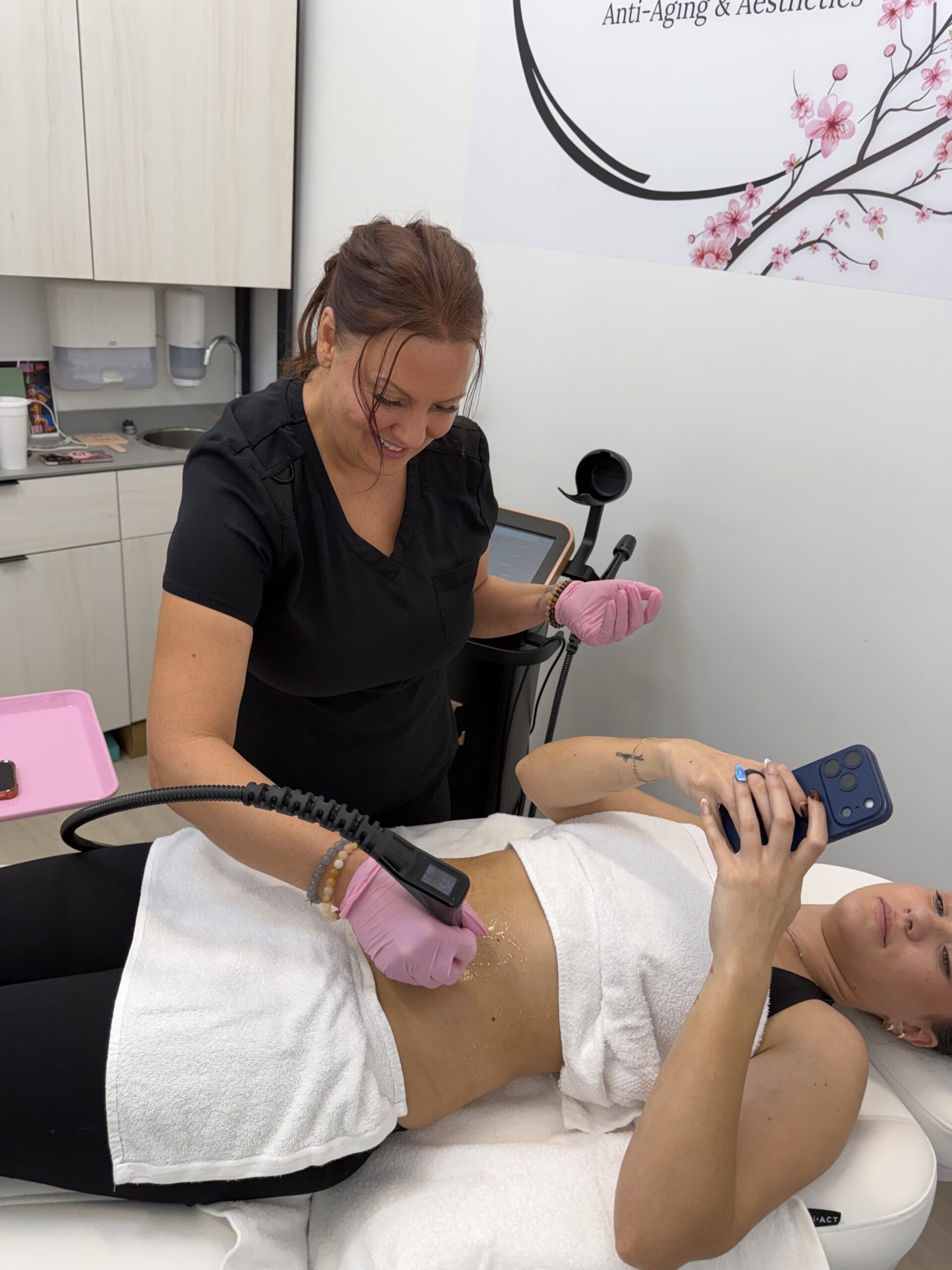 Laura McDonald, FNP-BC performing a triLift body treatment at Rewind Time Anti-Aging & Aesthetics in Lenexa, KS