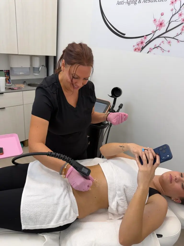 Laura McDonald, FNP-BC performing a triLift body treatment at Rewind Time Anti-Aging & Aesthetics in Lenexa, KS